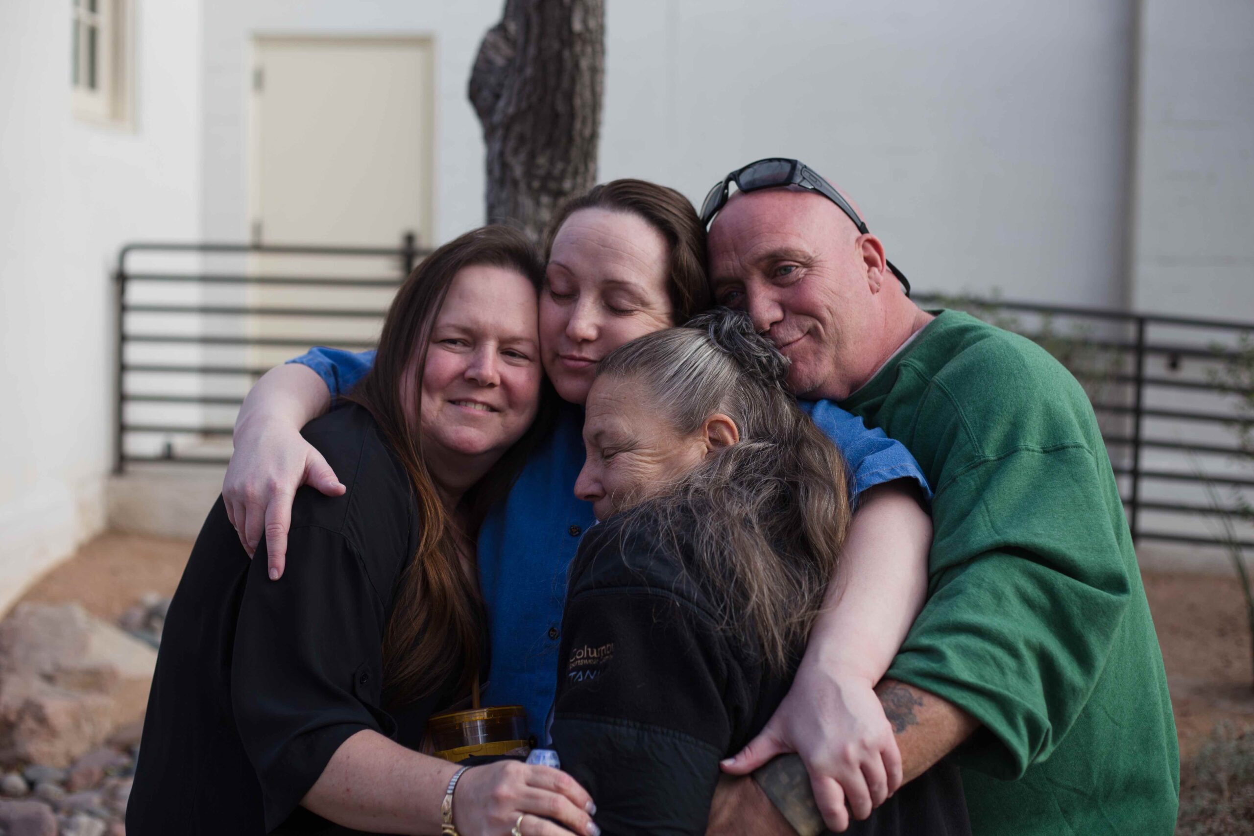 Kirstin Lobato hugging her family. Photo: Justin McAffee/Innocence Project.