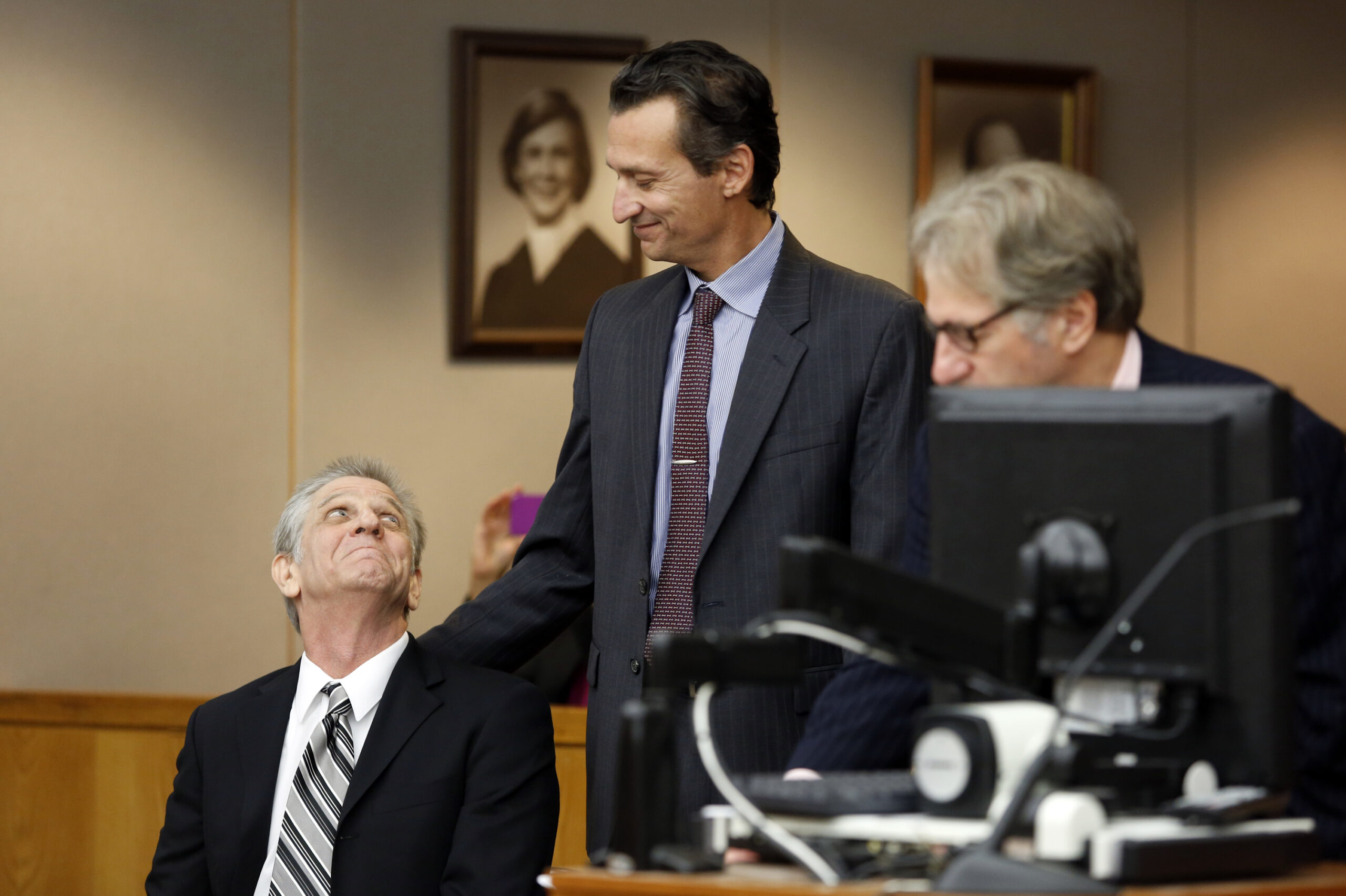 Steven Mark Chaney and Innocence Project Attorneys M. Chris Fabricant (center) and Barry Shack (right) during a hearing in a Dallas courtroom where a court reversed his 1987 murder conviction because of discredited bite mark testimony.ÊPhotographed on Monday, October 12, 2015. (Photo copyright Lara Solt)